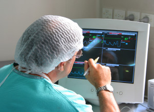 Doctor working with monitoring equipment